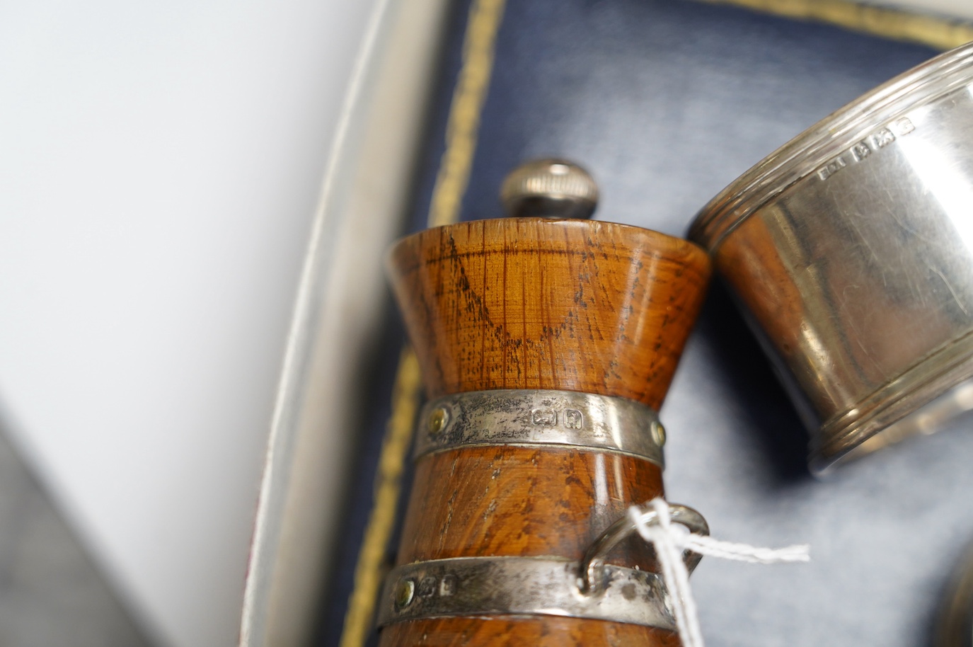 Small silver to include a cased Victorian silver Queens pattern christening trio, London 1837, four various silver napkin rings, a plated napkin ring, two condiments and a silver mounted wooden 'milk churn' pepper mill.